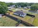 Lush backyard with wooden fence surrounding house featuring an expanse of green grass and neighborhood views at 14350 Se 36Th Ave, Summerfield, FL 34491
