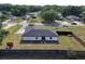 Lush backyard with wooden fence surrounding house featuring an expanse of green grass and neighborhood views at 14350 Se 36Th Ave, Summerfield, FL 34491