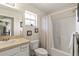Neutral bathroom featuring a sink, toilet, framed artwork and a shower and tub combo at 14350 Se 36Th Ave, Summerfield, FL 34491