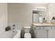 Bright bathroom featuring a large mirror, bathtub and shower at 14350 Se 36Th Ave, Summerfield, FL 34491