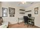 Functional carpeted room equipped with desk, shelving and a comfortable desk chair at 14350 Se 36Th Ave, Summerfield, FL 34491