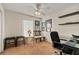 Comfortable room with desk, chair and furniture, complete with window and ceiling fan at 14350 Se 36Th Ave, Summerfield, FL 34491
