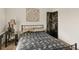 View of the well-lit carpeted bedroom featuring neutral walls and stylish décor at 14350 Se 36Th Ave, Summerfield, FL 34491