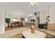Open-concept design featuring dining area with ample seating, a breakfast bar, and seamless flow to the living spaces at 14350 Se 36Th Ave, Summerfield, FL 34491