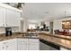Open-concept kitchen showcasing views to the dining and living spaces at 14350 Se 36Th Ave, Summerfield, FL 34491