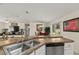 Open-concept kitchen showcasing views to the dining and living spaces at 14350 Se 36Th Ave, Summerfield, FL 34491