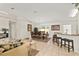 Bright, open-concept living room and dining room with tile flooring at 14350 Se 36Th Ave, Summerfield, FL 34491