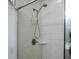 Clean and functional tiled shower with shower head at 14350 Se 36Th Ave, Summerfield, FL 34491