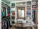 Organized walk-in closet with vanity and ample storage at 14350 Se 36Th Ave, Summerfield, FL 34491