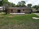 Large backyard with brick-paver patio perfect for outdoor gatherings, with plenty of room to play at 14466 Se 45Th Ct, Summerfield, FL 34491