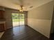 Dining area with luxury vinyl plank flooring, chair rail, and sliding glass door leading to backyard patio at 14466 Se 45Th Ct, Summerfield, FL 34491