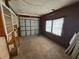 Spacious garage with storage shelving and a functional roll-up door, ready for vehicles and projects at 14466 Se 45Th Ct, Summerfield, FL 34491