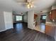 Open-concept living space with LVP flooring, connecting the living room, dining area, and kitchen at 14466 Se 45Th Ct, Summerfield, FL 34491