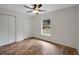 Comfortable bedroom features ample closet space and natural light; ideal for relaxation and storage at 14490 Se 96Th Ter, Summerfield, FL 34491