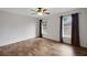 Bedroom with ceiling fan, two windows, and wood-look flooring at 14490 Se 96Th Ter, Summerfield, FL 34491