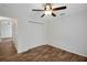 Clean bedroom with ceiling fan and closet offers a cozy and inviting atmosphere at 14490 Se 96Th Ter, Summerfield, FL 34491