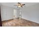 Bedroom with wood-look flooring and access to a bathroom at 14490 Se 96Th Ter, Summerfield, FL 34491