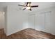 Clean bedroom with ceiling fan offers plenty of space and double closets at 14490 Se 96Th Ter, Summerfield, FL 34491