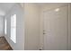 Bright entryway with a large window and neutral paint setting an inviting tone for visitors at 14490 Se 96Th Ter, Summerfield, FL 34491