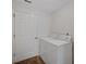 Clean laundry room with washer, dryer, and a door; freshly painted, showing cleanliness at 14490 Se 96Th Ter, Summerfield, FL 34491