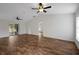 Spacious living room featuring vaulted ceilings and sliding glass door at 14490 Se 96Th Ter, Summerfield, FL 34491