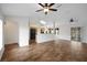 Open-concept living room with kitchen view and lots of natural light at 14490 Se 96Th Ter, Summerfield, FL 34491