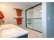 Bathroom featuring a modern sink with marble countertop and a sliding glass door shower, providing a sleek design at 14832 Royal Poinciana Dr, Orlando, FL 32828