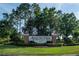 Welcoming entrance to Avalon Park with well-maintained landscaping, and a stately sign, inviting residents and visitors alike at 14832 Royal Poinciana Dr, Orlando, FL 32828