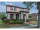 Charming two-story home featuring well-manicured landscaping and an inviting entrance at 14832 Royal Poinciana Dr, Orlando, FL 32828