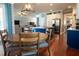 Open kitchen and breakfast area with stylish lighting, modern finishes, and an inviting atmosphere at 14832 Royal Poinciana Dr, Orlando, FL 32828