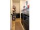 A functional laundry room with shelving and sleek, front-loading washer and dryer set at 14832 Royal Poinciana Dr, Orlando, FL 32828