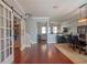Open-concept living area with hardwood floors, stylish furnishings, and modern decor at 14832 Royal Poinciana Dr, Orlando, FL 32828