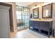 Elegant bathroom with a double sink vanity and a modern glass-enclosed shower at 14832 Royal Poinciana Dr, Orlando, FL 32828