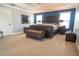 This main bedroom is bright and spacious, featuring unique dark wood furniture and trunk decor at 14832 Royal Poinciana Dr, Orlando, FL 32828