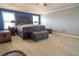Bright main bedroom with a distinctive headboard, complementing trunk-style accent pieces at 14832 Royal Poinciana Dr, Orlando, FL 32828
