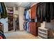 Organized walk-in closet with abundant storage shelves and hanging racks for clothing at 14832 Royal Poinciana Dr, Orlando, FL 32828
