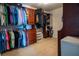 Spacious walk-in closet with built-in organization systems and ample hanging space at 14832 Royal Poinciana Dr, Orlando, FL 32828