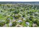 Aerial view of a home with a screened pool near community amenities at 17819 Se 105Th Ct, Summerfield, FL 34491