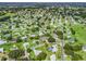 Aerial view of a home in a golf community featuring lush green spaces at 17819 Se 105Th Ct, Summerfield, FL 34491