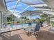 Enjoy the outdoors in this pool area with a lounge area, seating, privacy screen, and sparkling pool at 17819 Se 105Th Ct, Summerfield, FL 34491