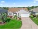 An aerial view showing the home, driveway, and manicured front yard landscaping at 17916 Se 87Th Melrose Ct, The Villages, FL 32162