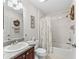 Bathroom featuring a single sink, vanity, tub, and shower combo at 17916 Se 87Th Melrose Ct, The Villages, FL 32162