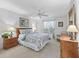 Charming bedroom with ceiling fan, neutral walls, and carpet floors at 17916 Se 87Th Melrose Ct, The Villages, FL 32162