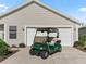 Home with driveway featuring a golf cart parked outside the garage at 17916 Se 87Th Melrose Ct, The Villages, FL 32162
