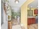 Inviting entryway leading to the living area and kitchen with tile flooring at 17916 Se 87Th Melrose Ct, The Villages, FL 32162