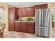 Well-organized kitchen with a stainless steel refrigerator, and plenty of cabinet storage at 17916 Se 87Th Melrose Ct, The Villages, FL 32162