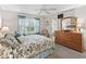 Inviting main bedroom with natural light, neutral tones, and closet access at 17916 Se 87Th Melrose Ct, The Villages, FL 32162