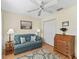 Home office featuring natural light, ceiling fan, and hardwood floors at 17916 Se 87Th Melrose Ct, The Villages, FL 32162