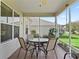 Screened patio with tiled floor and outdoor furniture at 17916 Se 87Th Melrose Ct, The Villages, FL 32162