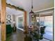 Casual dining area with a round table, counter seating, and access to the lanai at 1914 Armondo Dr, The Villages, FL 32159